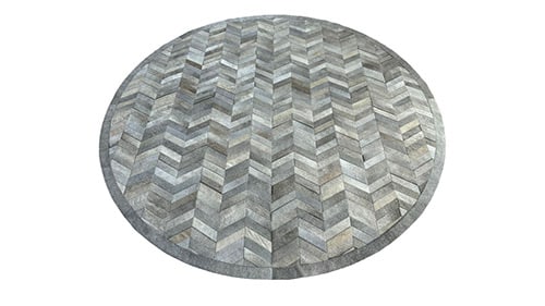 Round Grey Chevron Cowhide Rugs add distinction, texture and warmth to interior design projects
