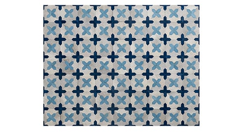 patchwork cowhide rug in off white and custom dyed dark blue and light blue colors
